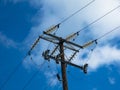 Close up of insulator power lines against blue sky Royalty Free Stock Photo