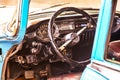 Close up interior of a classic vintage american car - steering wheel clock, dashboard, speedometer. Royalty Free Stock Photo