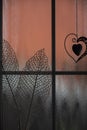 Close-up interior details. silhouettes of leaves and metal hearts.