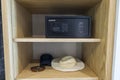 Close up interior view of belongings and safety deposit box in hotel`s wardrobe.