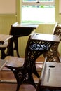 Close up interior view old 19th Century student desks in a schoolhouse Royalty Free Stock Photo