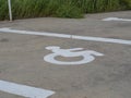Close-up of the international marking for parking spaces intended for the disabled, applied to the asphalt surface of the parking Royalty Free Stock Photo