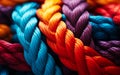 Close-up of intertwined colorful ropes in vibrant red blue and orange hues symbolizing strength connection and diversity Royalty Free Stock Photo