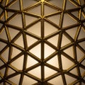 Closeup of an intricate golden geometric pattern with triangular shapes and warm light creating Royalty Free Stock Photo