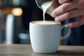 Close-up of intricate latte art pouring in a cup Royalty Free Stock Photo