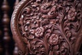 close-up of intricate wood carving on a mahogany antique chair