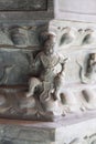 Close-up of intricately carved statues adorning the walls of the Beijing Wanshou Temple