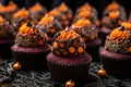 a close-up of intricately decorated halloween cupcakes