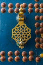 close-up of an intricately designed brass door knocker with a geometric pattern, Royalty Free Stock Photo