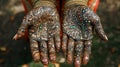 Close-up of intricately designed henna on hands with golden bangles Royalty Free Stock Photo