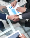 Close up. investor and businessman shaking hands Royalty Free Stock Photo