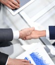 Close up. investor and businessman shaking hands Royalty Free Stock Photo