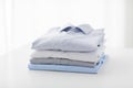 Close up of ironed and folded shirts on table Royalty Free Stock Photo