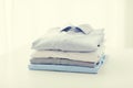 Close up of ironed and folded shirts on table Royalty Free Stock Photo