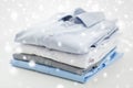 Close up of ironed and folded shirts on table Royalty Free Stock Photo