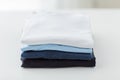 Close up of ironed and folded t-shirts on table Royalty Free Stock Photo