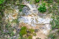 Close-up of an irregular and cracked limestone wall of a hill Royalty Free Stock Photo