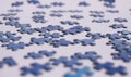 Close up of isolated blue puzzle pieces, white background Royalty Free Stock Photo