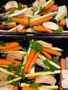 Close up of isolated bundles of fresh raw soup vegetables on german farmer market: leeks, carrots, celery and parsley