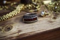 Close up isolated group gold precious jewellery chains and bracelets with silver ruby gem ring on wood table Royalty Free Stock Photo