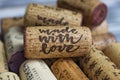 Close up of isolated natural wine cork with text made with love