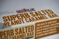 Close up of isolated package of the grown up chocolate company superb salted peanut caramel bar