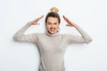 Close up isolated portrait of young annoyed angry woman holding hands in furious gesture. Negative human emotions, face expression