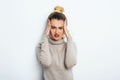 Close up isolated portrait of young stressed angry woman holding hands on head. Negative human emotions, headache face expressions Royalty Free Stock Photo