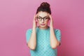 Close up isolated portrait of young stressed angry woman holding hands on head. Negative human emotions, headache face expressions Royalty Free Stock Photo