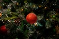 Close up of Isolated Red bobble on christmas tree. chirstmas concept. living room tree.