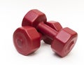 Close up isolated red fitness dumbbells.