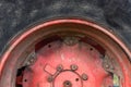 Close up of isolated red rim black wheel tire with deep sufficient tread of antique old tractor in Bulgaria Royalty Free Stock Photo