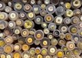 Close up of isolated stacked round boxes in an row with countless trouser buttons