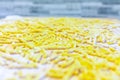 Close up of italian fresh pasta `passatelli` on a wooden chipper board with flour