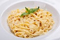 Close-up italian pasta plate with grated parmesan and bas Royalty Free Stock Photo