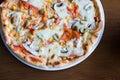 Close up Italian pizza with olives, tomatoes and che Royalty Free Stock Photo