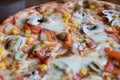 Close up Italian pizza about pizza with olives, tomatoes and cheese Royalty Free Stock Photo