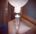 Close up IV saline solution drip for patient in hospital blur vintage Royalty Free Stock Photo