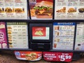 Close up of the Jack in the Box fast food burger menu board in the outside drive thru