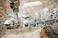 Close up of jackhammer - worker man using a jackhammer to drill into concrete Royalty Free Stock Photo