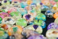 A close-up of jadeite. A pile of jade handicrafts are on display for sale.