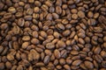 CLOSE UP OF JAMAICA BLUE MOUNTAIN COFFEE BEANS DARK BACKGROUND AND TEXTURE TOP VIEW Royalty Free Stock Photo