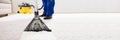 Janitor Cleaning Carpet With Vacuum Cleaner Royalty Free Stock Photo