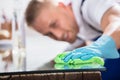 Close-up Of A Janitor Cleaning Desk With Cloth Royalty Free Stock Photo