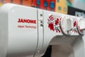 Close-up of Janome brand logo on a sewing machine. Minsk, Belarus, 2023 Royalty Free Stock Photo
