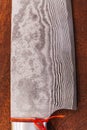 Close up Japanese cook`s knife stainless steel blade wave pattern, Damascus style kitchen knife texture