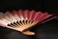 Close up Japanese hand fan on black background