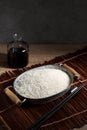 Close up Japanese rice in measuring cup on table Royalty Free Stock Photo