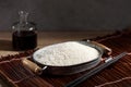 Close up Japanese rice in measuring cup on table Royalty Free Stock Photo