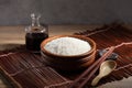 Close up Japanese rice in measuring cup on table Royalty Free Stock Photo